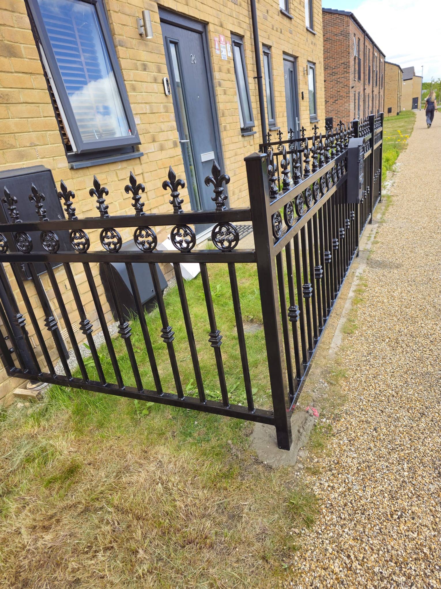 Custom decorative steel railings with spearhead finials and scrollwork
