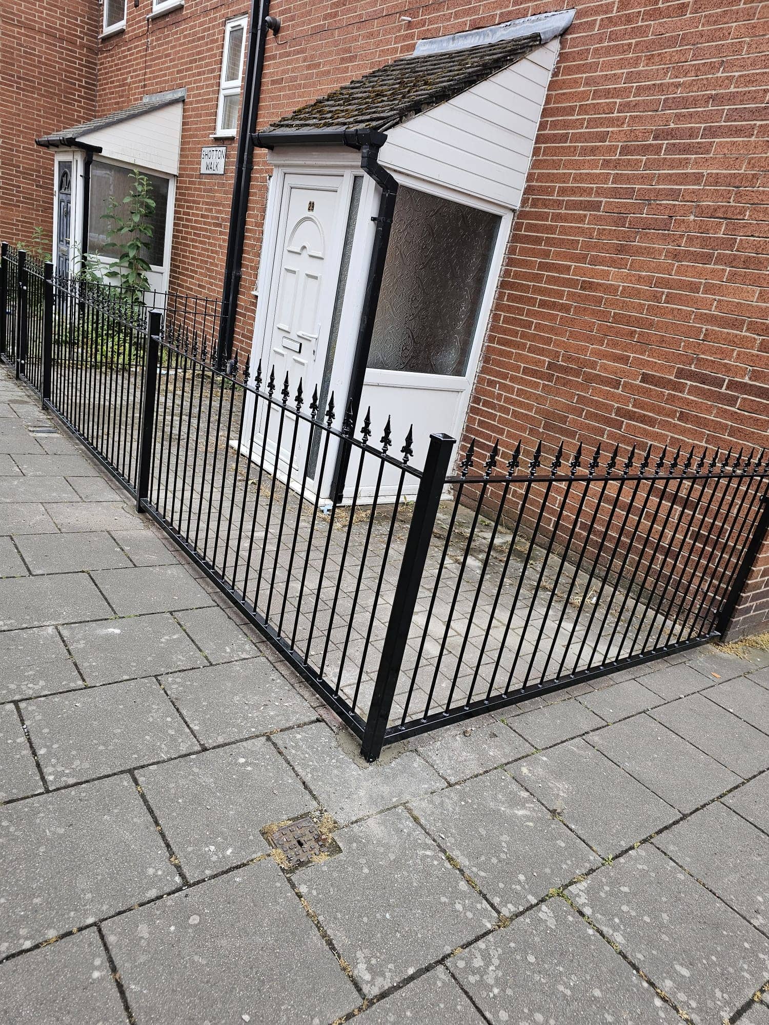 Contemporary steel railings with decorative rings and spearhead tops